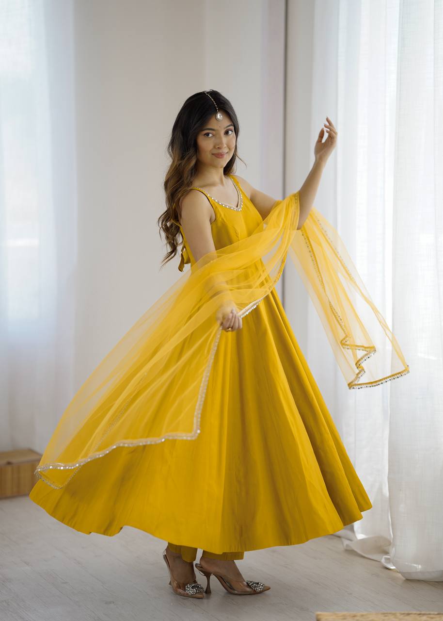Attractive Yellow Color Roman Silk Lace Work Anarkali Suit